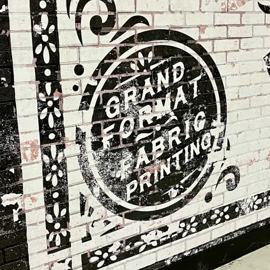 Signage Featuring DPI Faux Brick Paneling